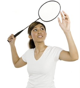 This is a photo of a girl with a badminton racquet. 