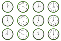 This is a photo of a set of clocks indicating different times.
