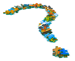 This is a photo of a question mark made out of puzzle pieces.