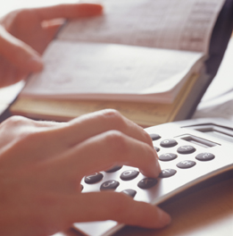 This is a photograph of a person balancing a checkbook.