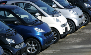 This is a picture of multiple cars parked beside each other.