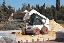 This is a picture of a bobcat machine at a construction site.