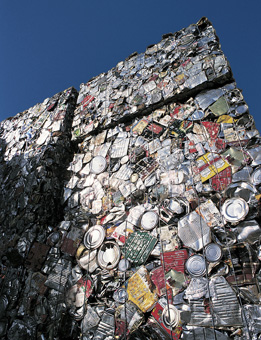 This image shows crushed cans stacked in large bales. 
