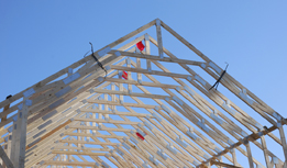 This photograph shows triangular roof trusses.