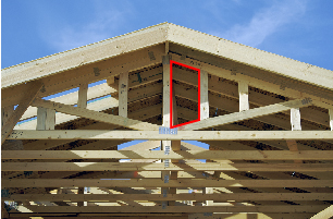 This photograph shows the framing of a new house with a quadrilateral outlined in red.