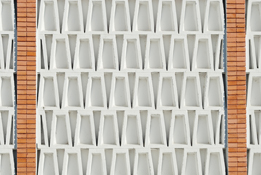 This photograph is of a wall that contains trapezoids.