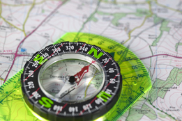 This is a photo of a compass on a map.
