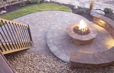 This is a photograph of a patio with a fire pit.