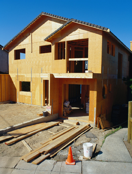 This is a photograph of a partially built house under construction.