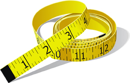 This is a photograph of a yellow tape measure marked in inches with the smallest division as one-eighth.