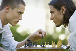 This is a photo of two men playing chess.