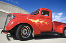 This is a photo of a red two-door truck.