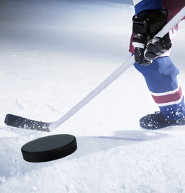 This is a picture of hockey player shooting a puck.