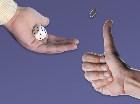 This shows a hand rolling a die and a hand flipping a coin.