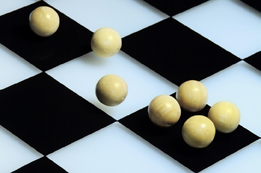 This is a picture of a game board with marbles on it.