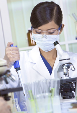 This is a photo of a woman with a microscope.