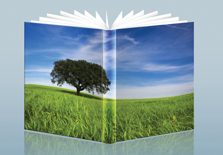 This is a photo of a textbook cover. On the cover is a photo of a tree in a field of grass against a blue sky.