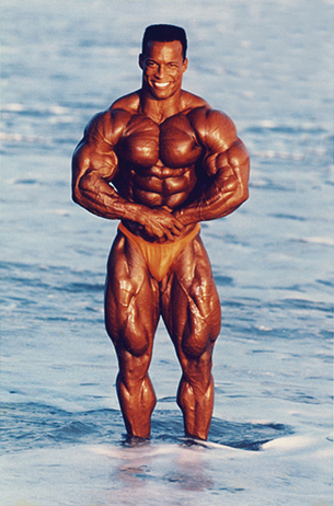 This photo shows a body builder flexing his muscles.