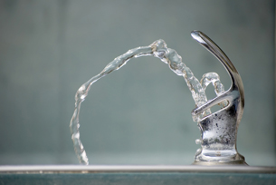 This photo is of drinking water flowing from a water fountain.