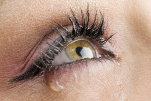 This is a close-up photo of a tearing eye.