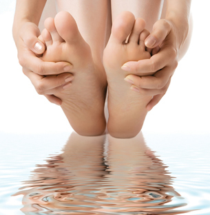 The photo illustrates how excess hGH can cause the hands and feet to widen and enlarge.