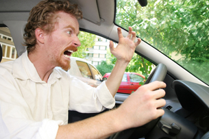 Strong emotions, such as anger, elicit the short-term stress response, as illustrated in this photo of a frustrated driver.