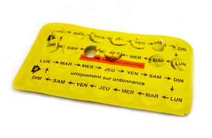 The photo shows the back of a yellow  punch pack of menopausal pills.
