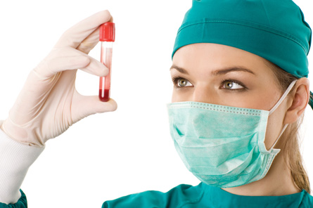 The photo shows a doctor looking at a vial of blood.