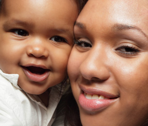The photo shows a mother and son with similar facial features.