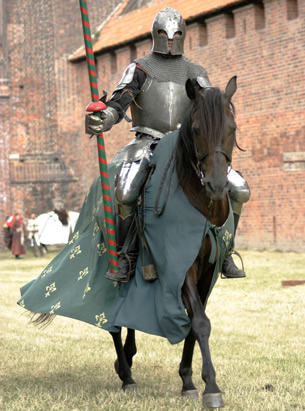 The photo shows a knight in armour on a horse.