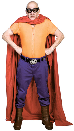 The photo shows a middle-aged man dressed as an everyday superhero.