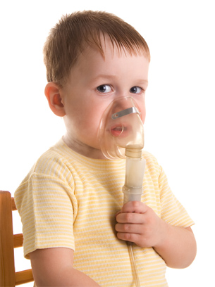 The photo shows a child with a nebulizer.