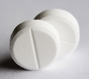 A photograph of two ASA tablets.