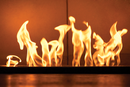 A photograph shows the flames from a fireplace.