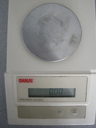 Photo 1: This photograph shows the empty balance with a reading of zero.