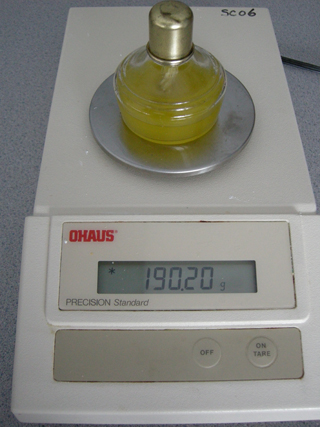 Photo 4: This photograph shows the spirit burner filled with biodiesel sitting on the balance, so that the initial mass can be read.