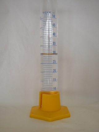 Photo 5: This photograph shows the graduated cylinder filled with 30.0 mL of distilled water.