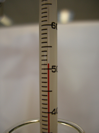 Photo 13: This photograph shows a thermometer displayed so that the final water temperature can be read.