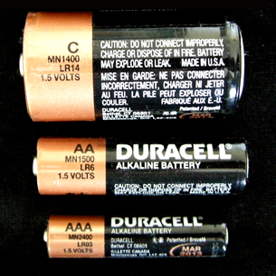 A photograph shows three consumer cells: sizes AAA, AA, and C. The label on each cell states that the voltage is 1.5 V.