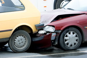 This picture shows a red car that has just rear-ended a yellow car.