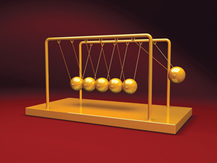 An image of Newton’s cradle is shown.
