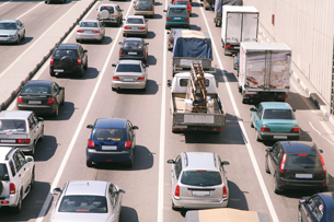 A photo shows a traffic jam on a multilane divided highway.
