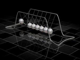A two-sequence image shows two positions in a Newton’s cradle, a pendulum device with seven silver balls in a row, each suspended by two strings that are attached to opposite sides of the top of a frame. The first position shows the ball at the left end of the row in motion, away from the row of balls and swinging toward it. The second position shows the left ball stationary in the row of balls and the ball at the right end of the row swinging forward away from the rest.  