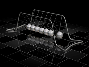 A two-sequence image shows two positions in a Newton’s cradle, a pendulum device with seven silver balls in a row, each suspended by two strings that are attached to opposite sides of the top of a frame. The first position shows the ball at the left end of the row in motion, away from the row of balls and swinging toward it. The second position shows the left ball stationary in the row of balls and the ball at the right end of the row swinging forward away from the rest.  