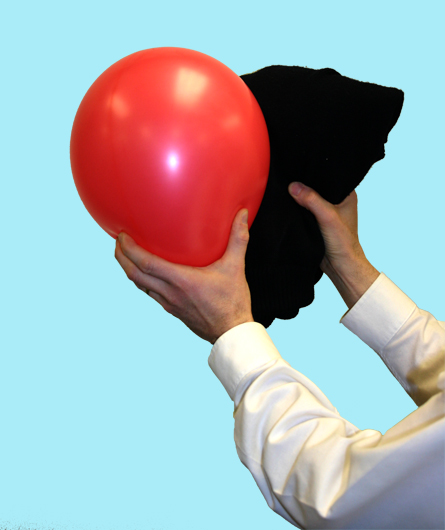 In the photo a balloon is shown being rubbed with a wool sweater.