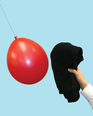 In the first photo, a balloon suspended by a thread is attracted to a wool sweater.
