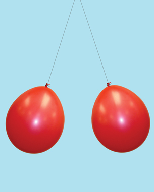 In the second photo, two balloons are suspended from a point on a ceiling.  The balloons are both repelling one another.