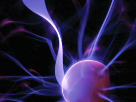An extreme close-up photo of a plasma lamp shows the blue and purple streamers leaving the central orb.