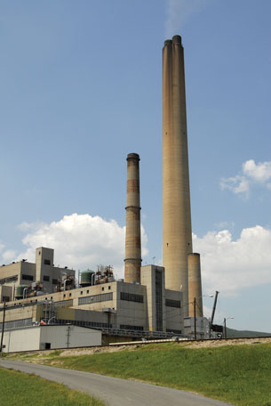 A photo shows the smokestack of a coal-fired power plant.