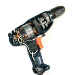 A photograph shows a cut away view of the inside of an electric drill. Electric drills convert electrical energy into mechanical energy.